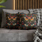 Decorative pillows with floral patterns on a gray sofa.