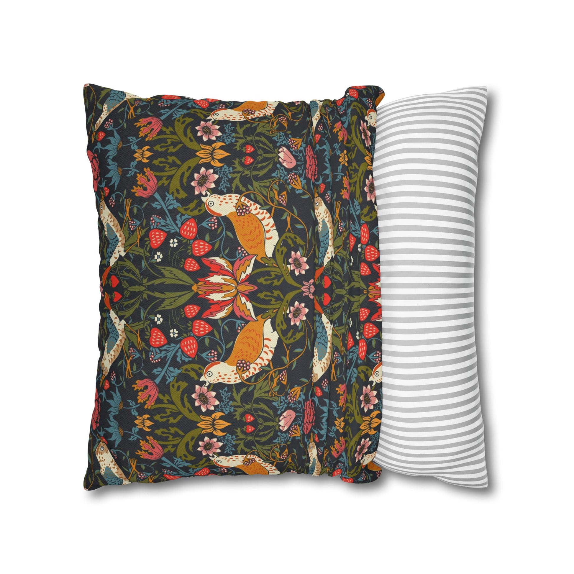 Decorative pillow with fox and floral pattern next to a striped pillow on a white background