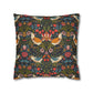 Decorative pillow with a floral and bird pattern on a white background