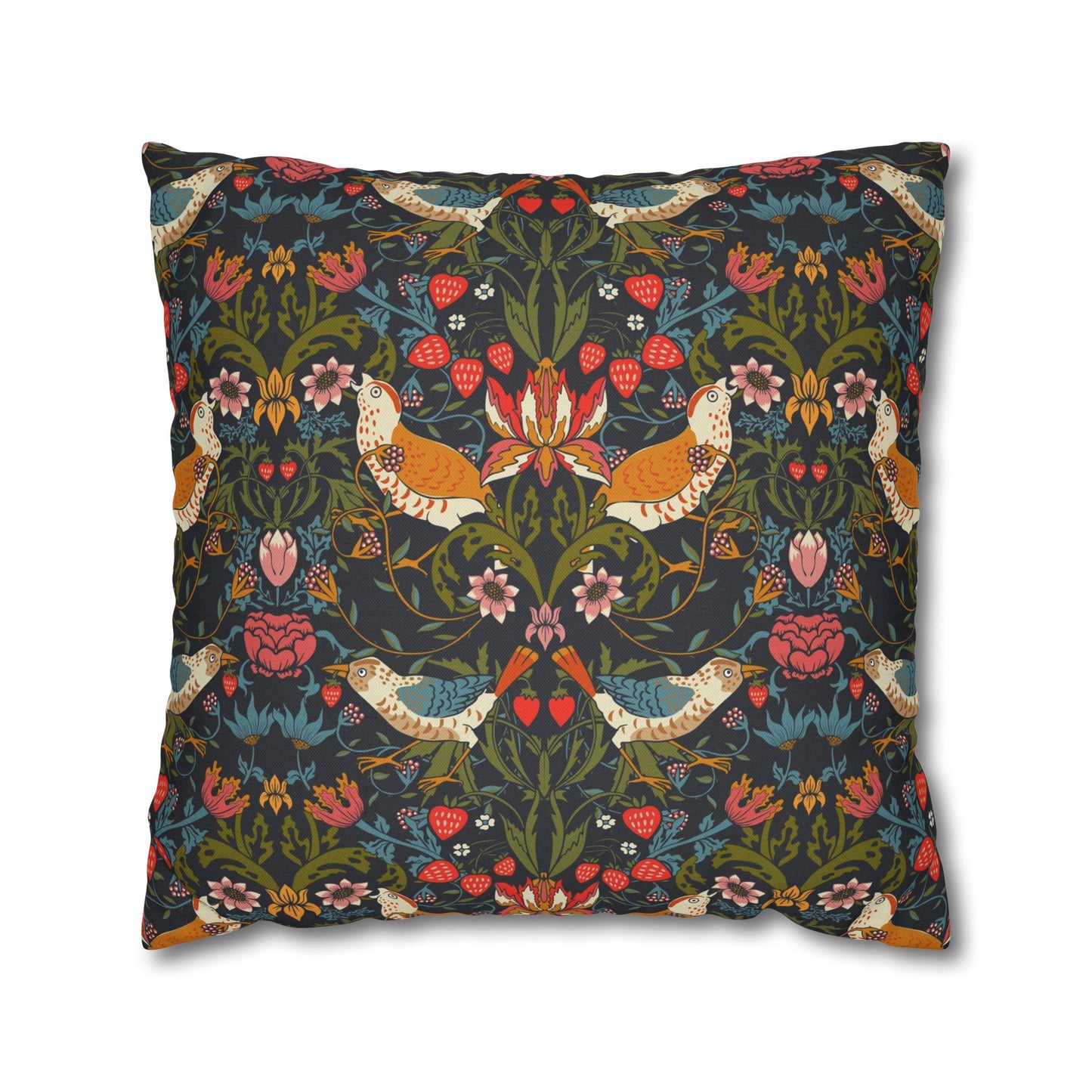Decorative pillow with intricate floral and bird pattern on a dark background