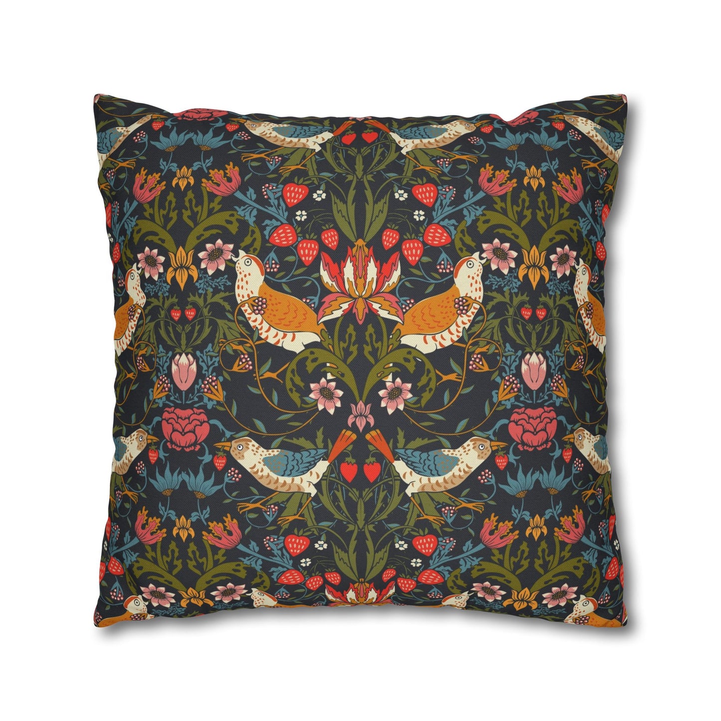 Decorative pillow with intricate floral and bird pattern on a dark background