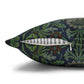 Decorative pillow with floral pattern and a feather on a white background
