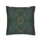 Decorative pillow with intricate green and blue pattern on a white background