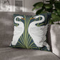 Decorative pillow with swan design on a gray sofa
