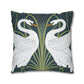 Decorative pillow with swan design on a dark blue background