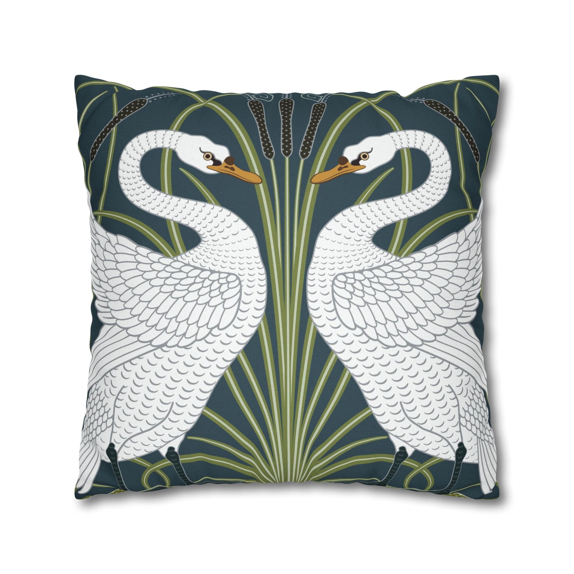Decorative pillow with swan design on a dark blue background
