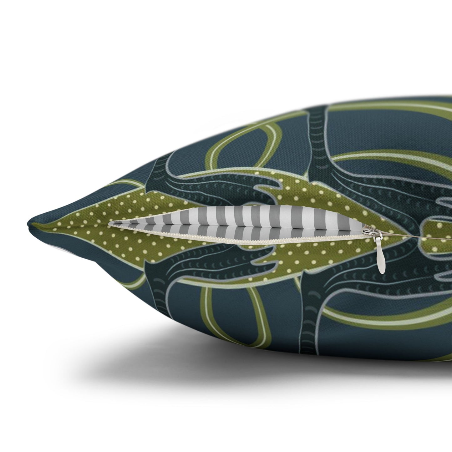 Decorative pillow with a green and blue pattern on a white background