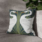 Decorative pillows with swan design on a gray couch