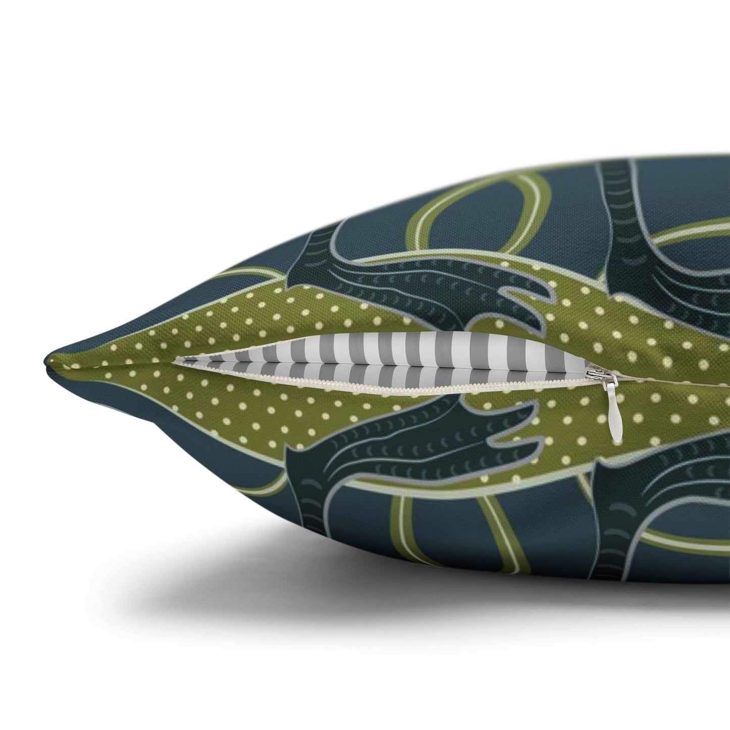 Decorative pillow with a green and blue pattern on a white background