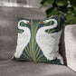Decorative pillow with swan design on a gray sofa