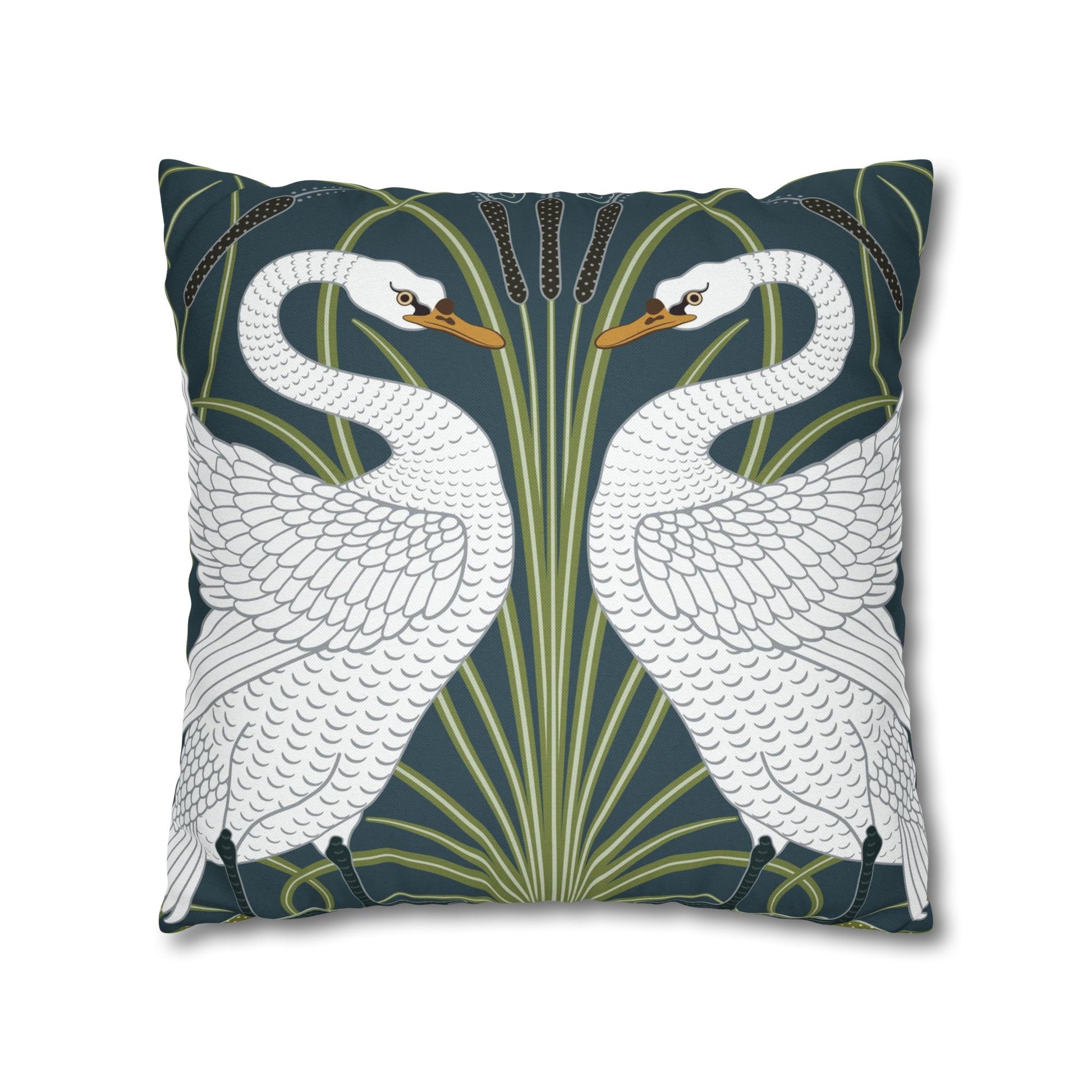 Decorative pillow with two swans on a dark blue background