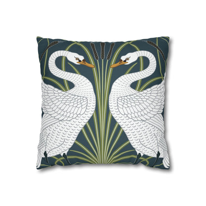 Decorative pillow with swan design on a dark blue background