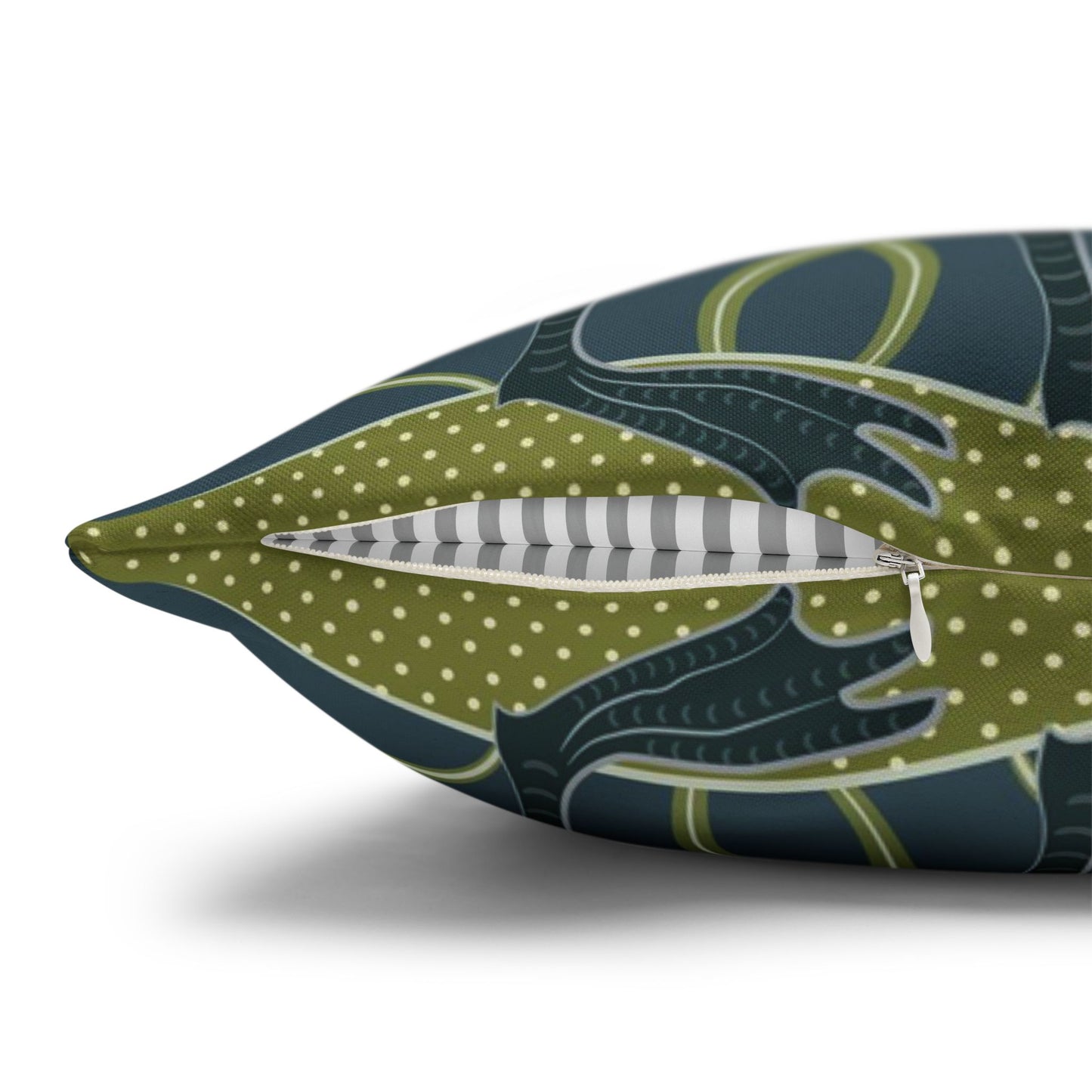 Decorative pillow with a green and blue pattern on a white background