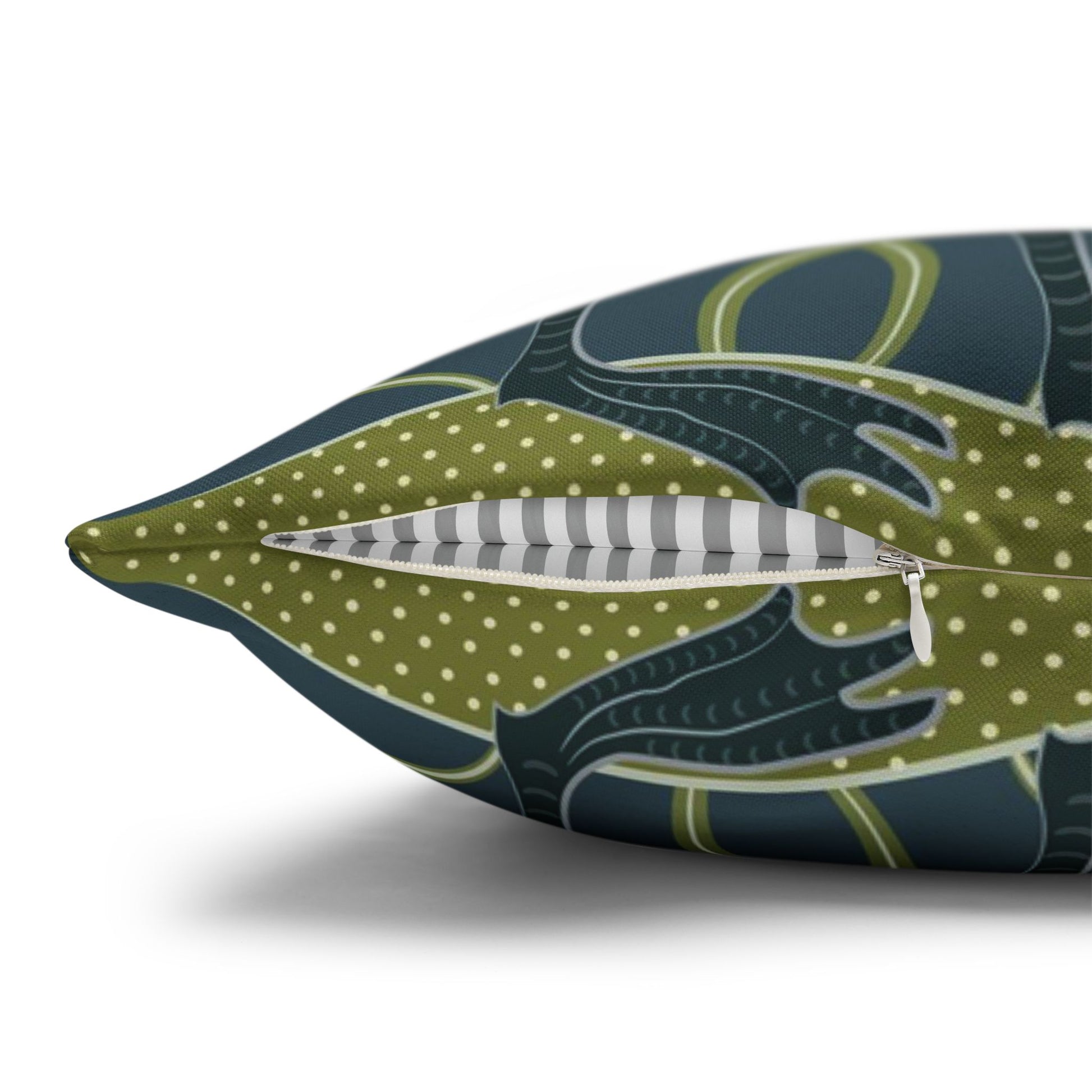 Decorative pillow with a green and blue pattern on a white background