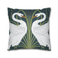 Decorative pillow with swan design on a dark blue background