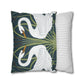 Decorative pillow with swan design and a striped pillow next to it on a white background