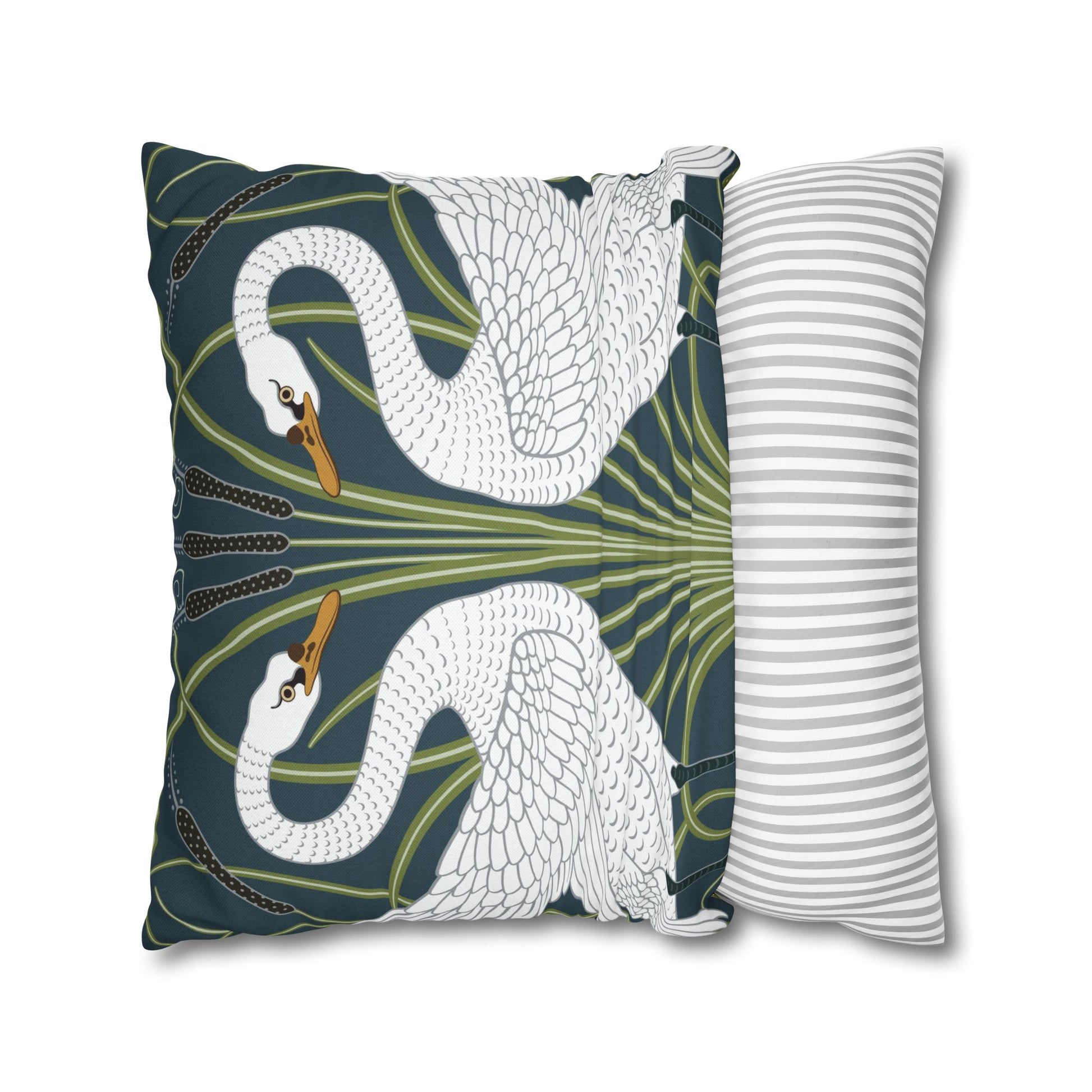 Decorative pillow with swan design and a striped pillow next to it on a white background