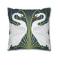Decorative pillow with swan design on a dark blue background