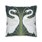 Decorative pillow with swan design on a dark blue background