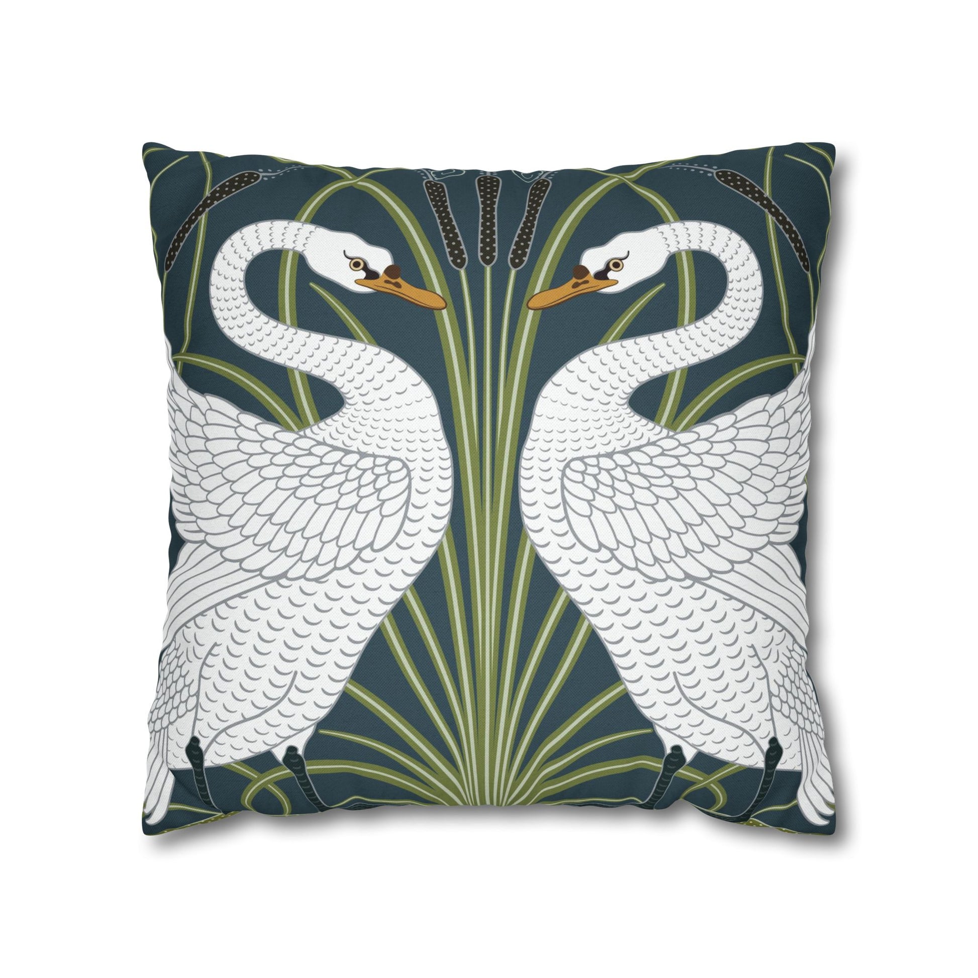 Decorative pillow with swan design on a dark blue background