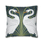 Decorative pillow with swan design on a dark green background
