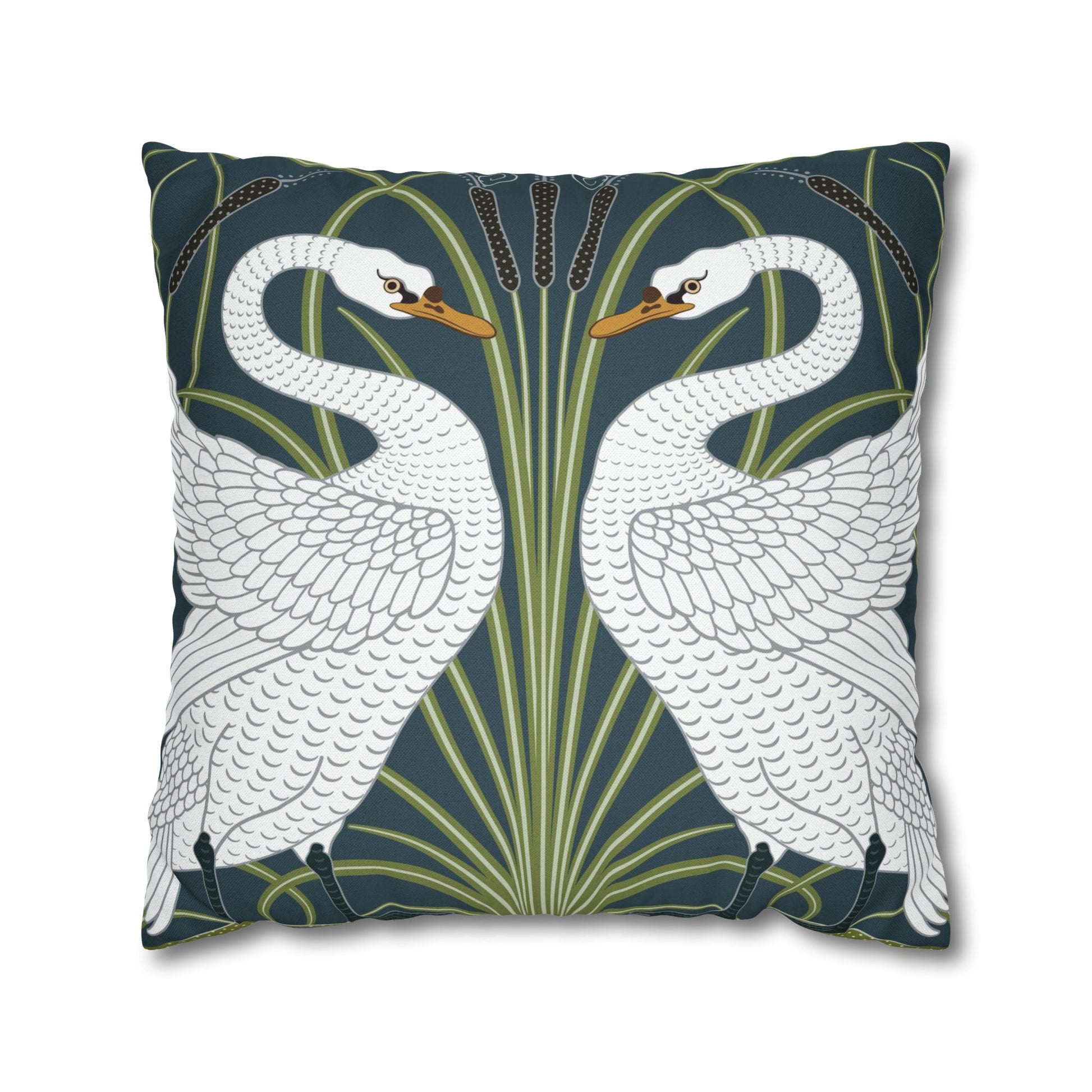 Decorative pillow with swan design on a dark green background