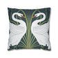 Decorative pillow with swan design on a dark blue background