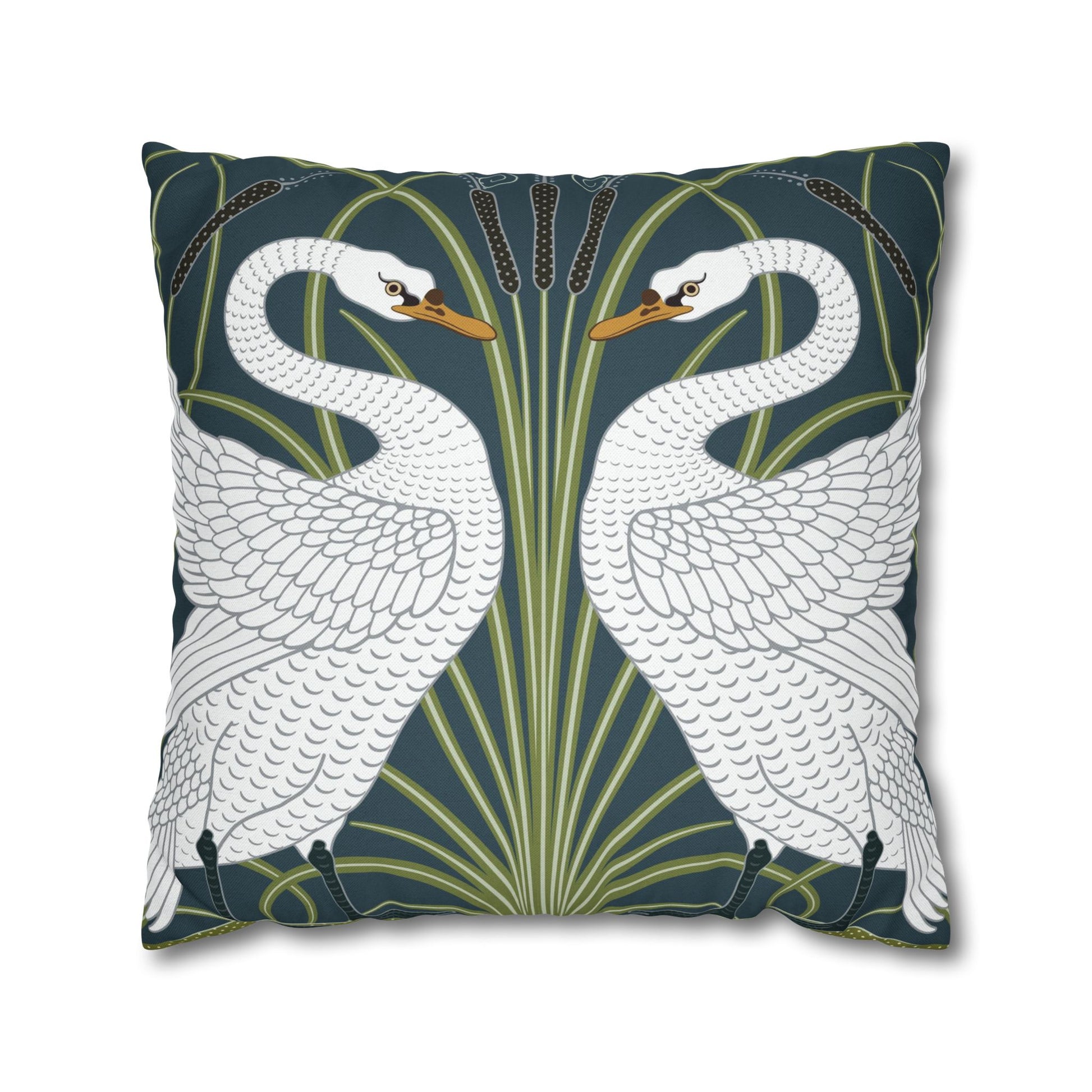Decorative pillow with swan design on a dark blue background