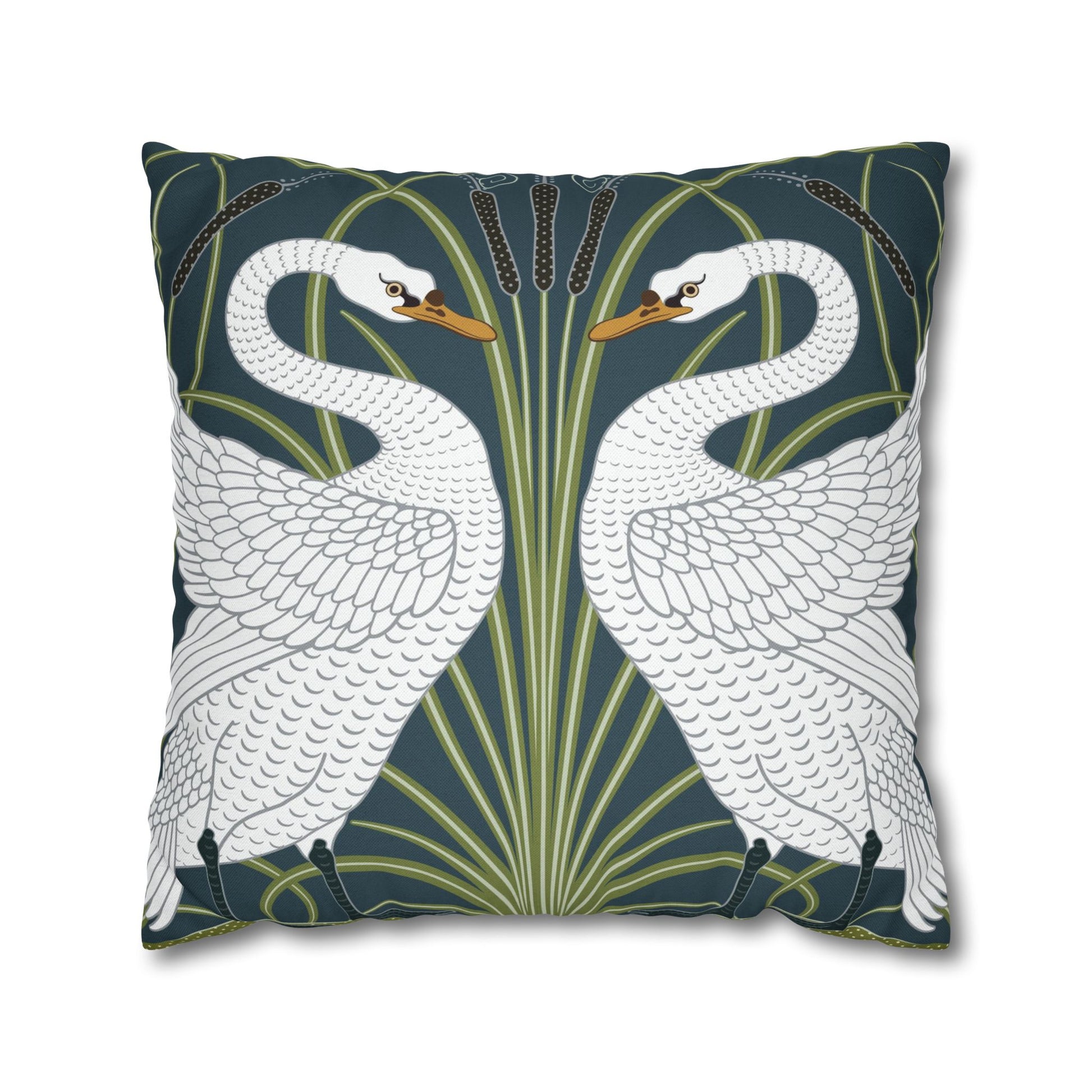 Decorative pillow with swan design on a dark green background