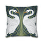 Decorative pillow with swan design on a dark green background