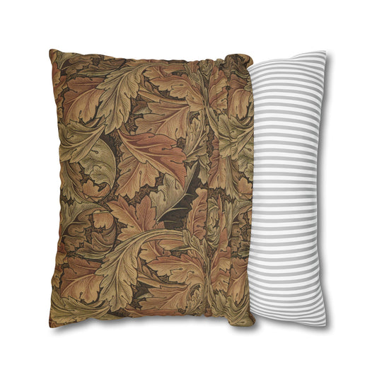 Decorative pillow with leaf pattern next to a striped pillow on a white background