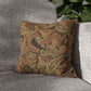 Decorative pillow with leaf pattern on a gray sofa