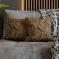 Decorative pillows with floral pattern on a gray sofa