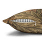 Decorative pillow with leaf pattern and zipper on a white background