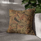 Decorative pillow with leaf pattern on a gray sofa