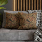 Decorative pillows on a sofa with a wooden headboard in the background