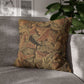 Decorative pillow with leaf pattern on a gray sofa