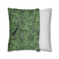 Two pillows, one with green leaf pattern and one with white stripes, on a white background.