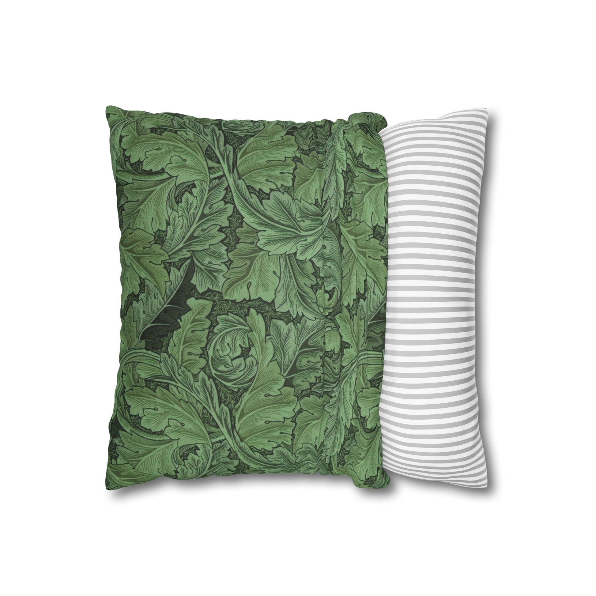 Green patterned pillow and white striped pillow on a white background
