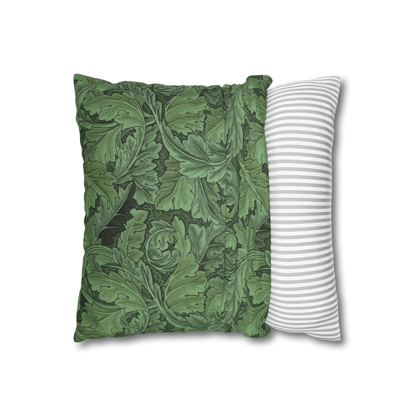 Two pillows, one with green leaf pattern and the other with white stripes, on a white background.