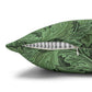 Green patterned pillow with a zipper on a white background