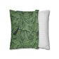 Green patterned pillow and white and gray striped pillow on a white background
