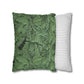 Two pillows, one with green leaf pattern and the other with white stripes, on a white background.