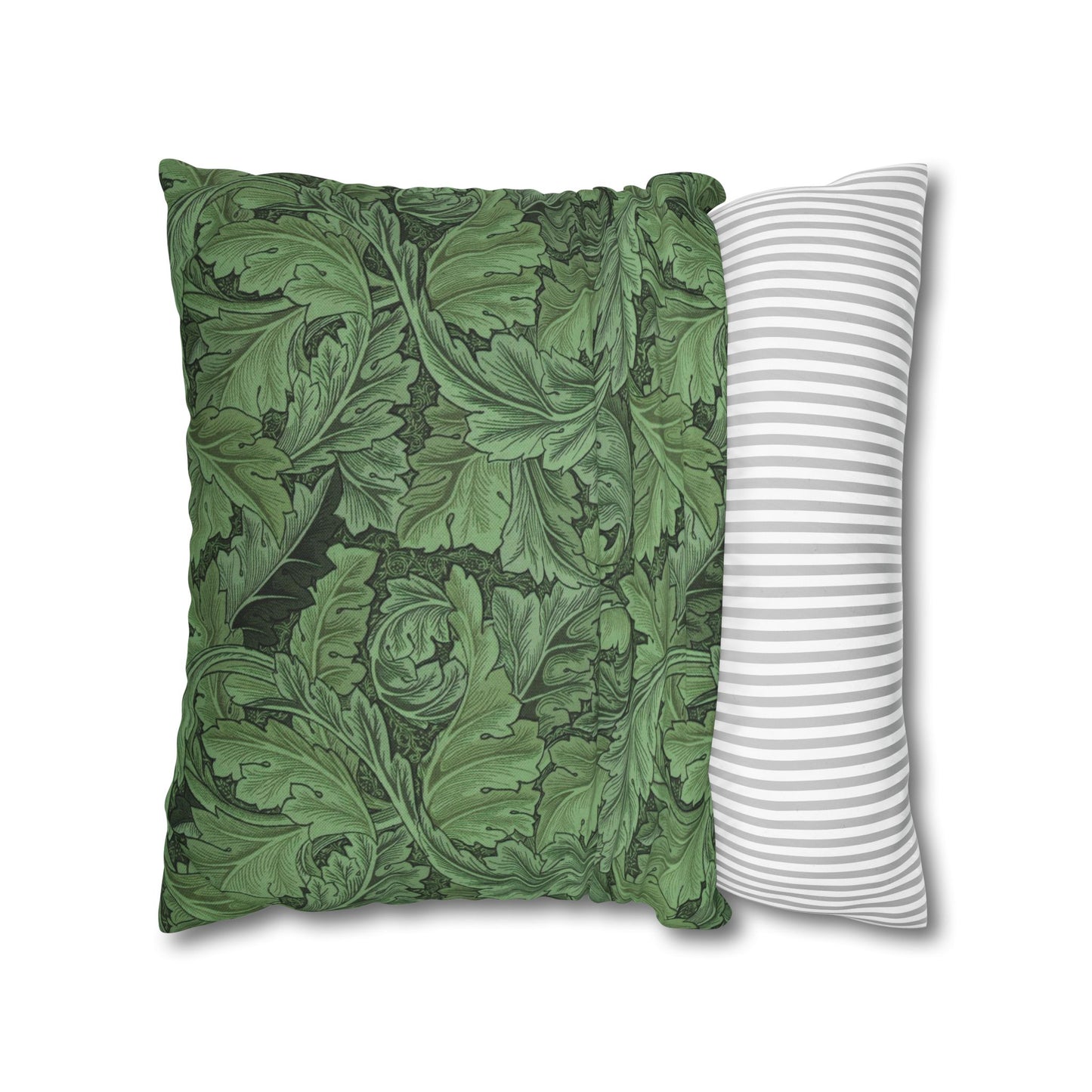 Two pillows, one with green leaf pattern and the other with white stripes, on a white background.