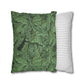Two pillows, one with green leaf pattern and the other with white stripes, on a white background.