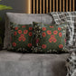 Floral patterned cushions on a gray sofa with a wooden headboard in the background.