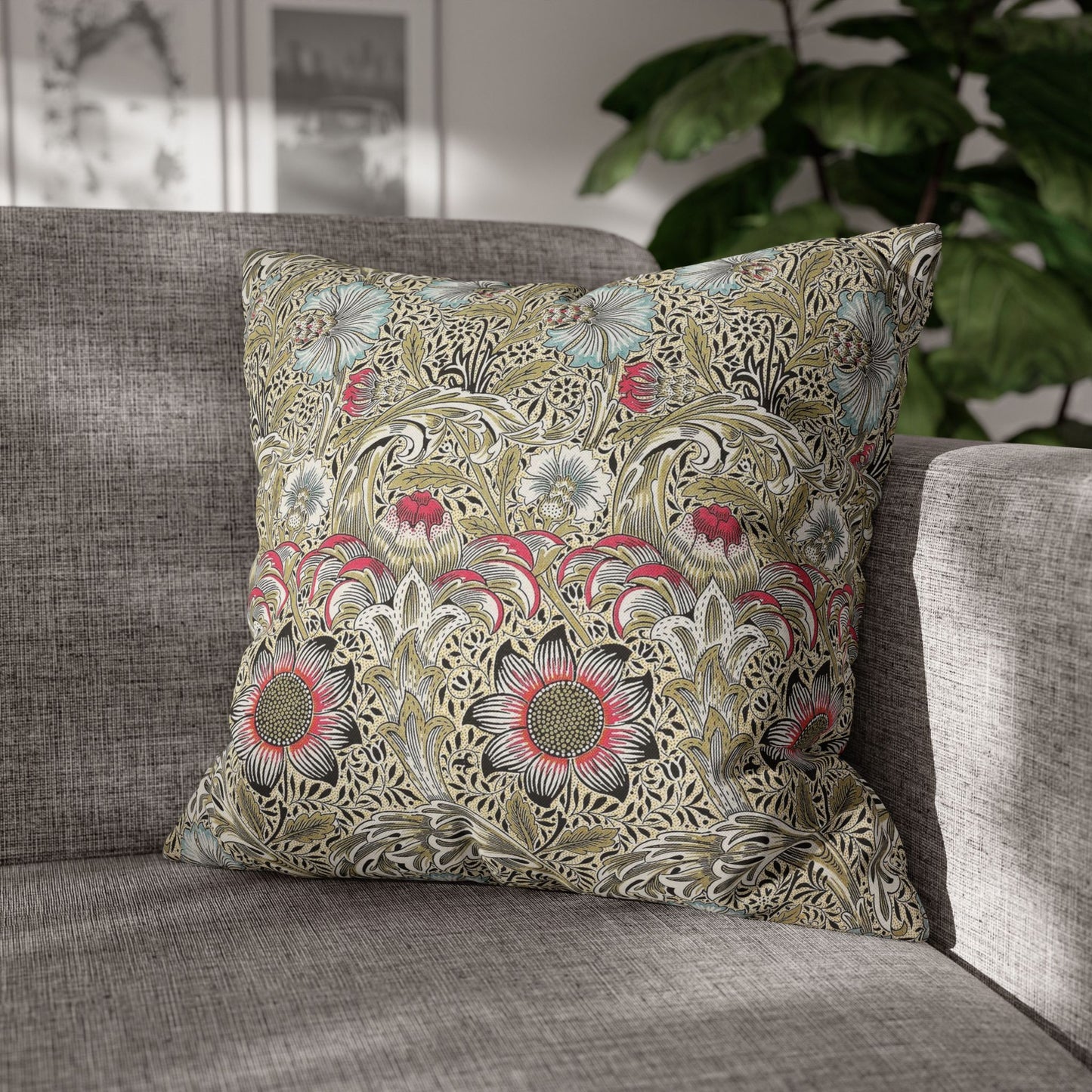 Decorative pillow with floral pattern on a gray sofa