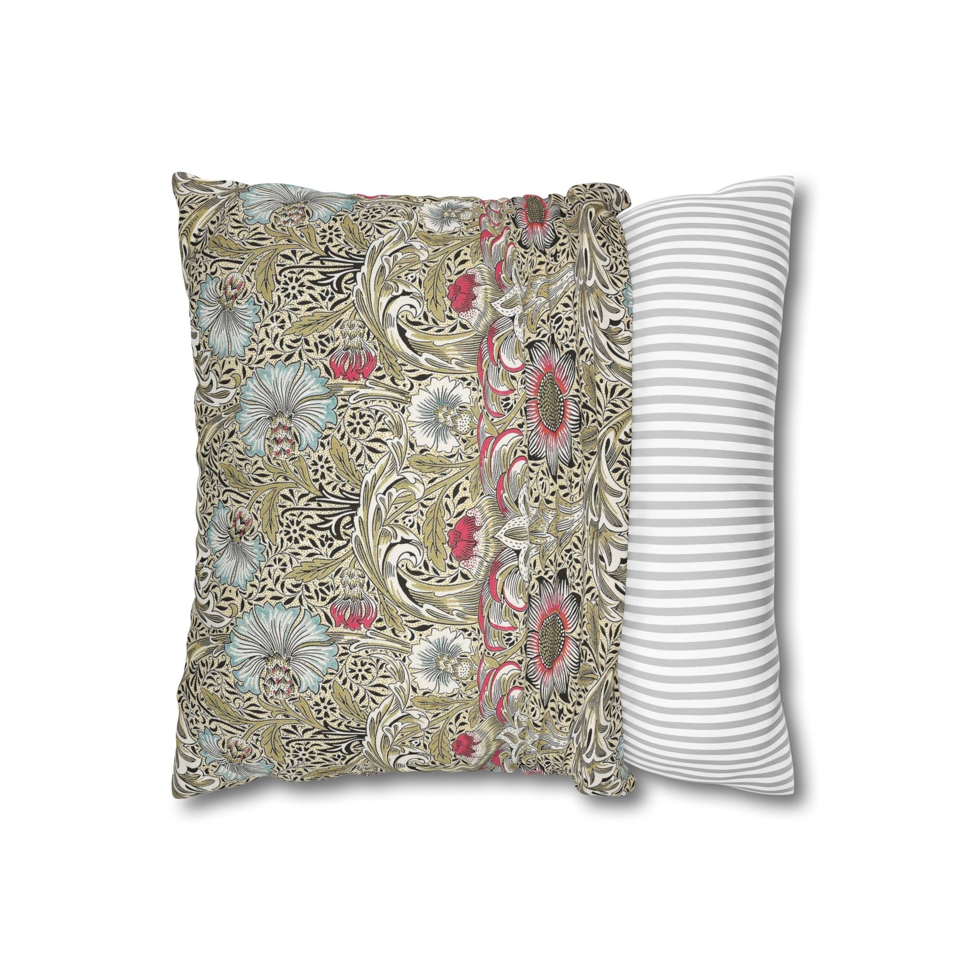 Decorative pillow with floral pattern next to a striped pillow on a white background