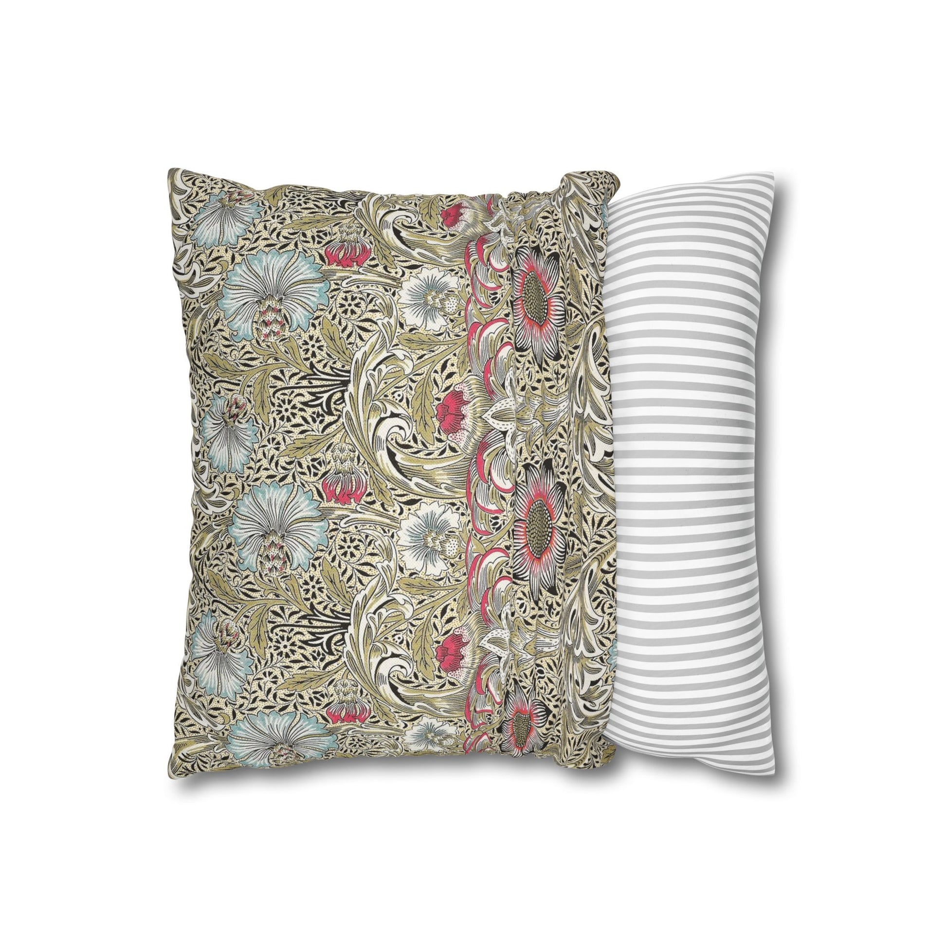 Decorative pillow with floral pattern next to a striped pillow on a white background