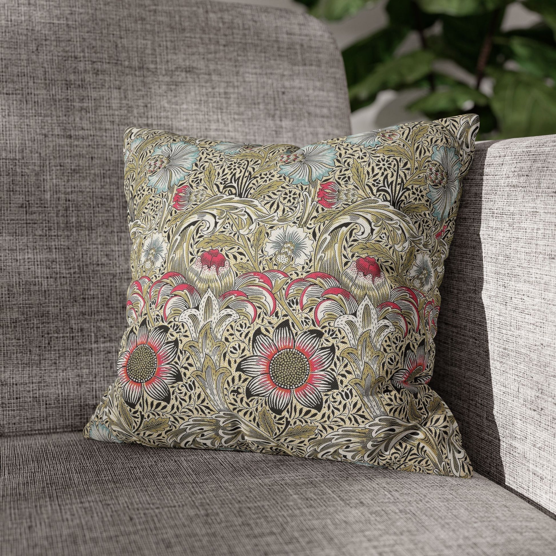 Decorative pillow with floral pattern on a gray sofa